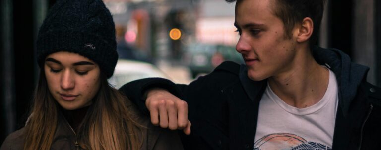 Teenagers sharing a moment outdoors in Stratford, Canada.